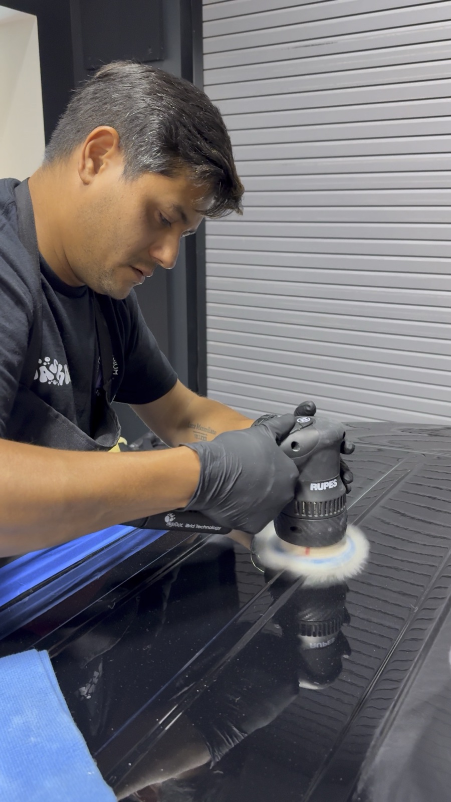 Paint correction — polisher restoring deep gloss finish